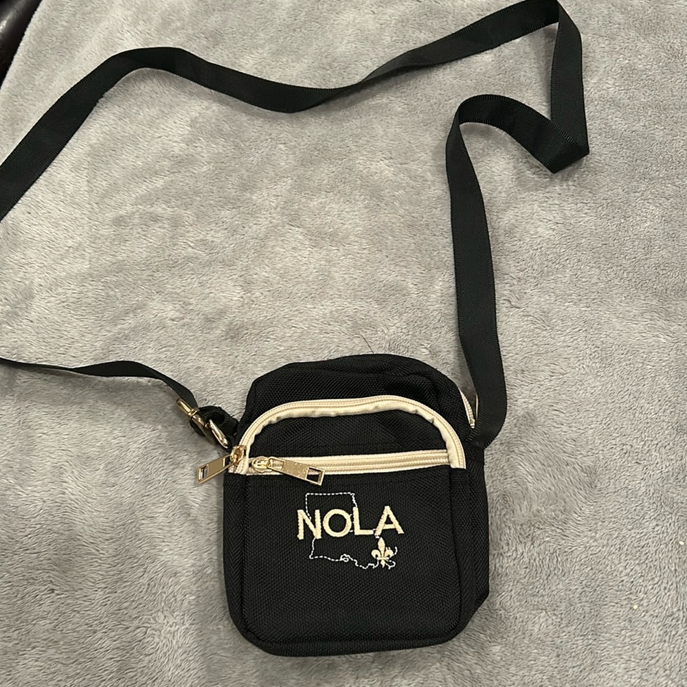 Nola mini crossbody purse new and never used